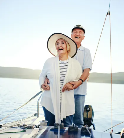 A couple enjoying a day out on their sailboat